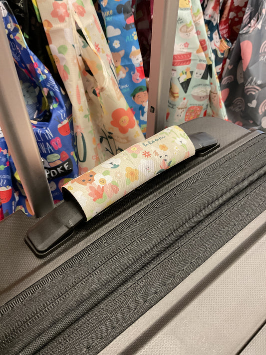 EDEN LUGGAGE WRAP IN FULL BLOOM TAUPE